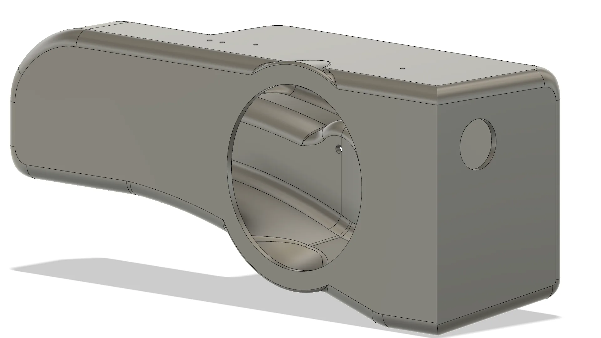 3D-rendered mechanical component with cylindrical cutout and multiple surfaces.